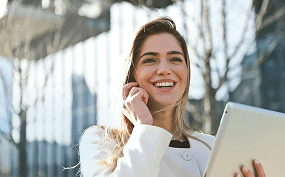 Woman with laptop smiling